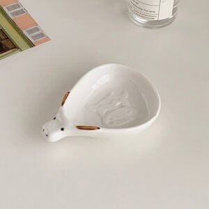 Cute household condiment dish with embossed design, ceramic vinegar dish, and various dipping sauces.